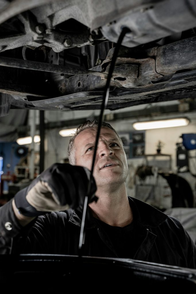 Mechanic working on a car in the workshop